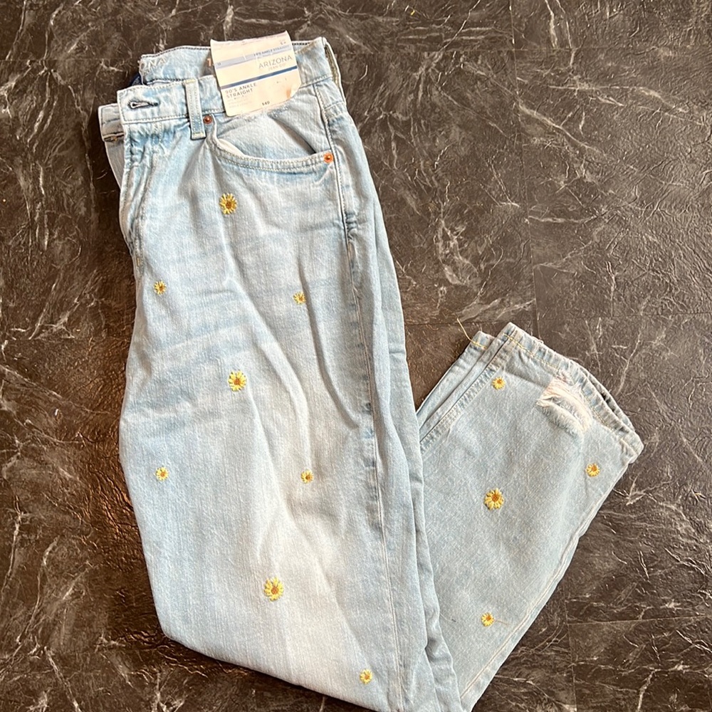 Light blue jeans with sunflower embroidery